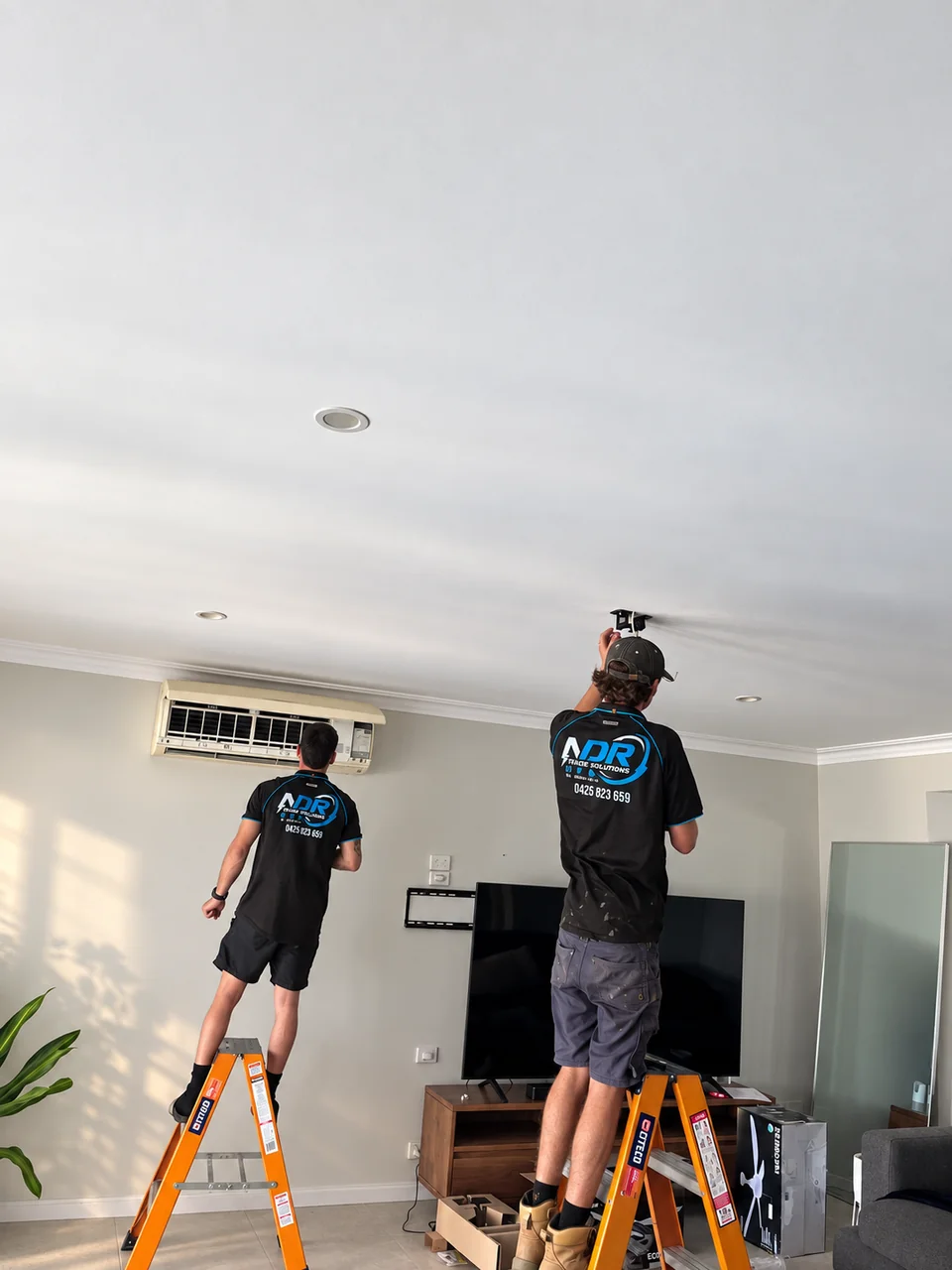 NDR technicians working on an indoor air conditioning installation