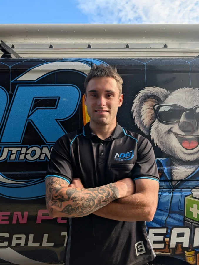 Josh beside an NDR van